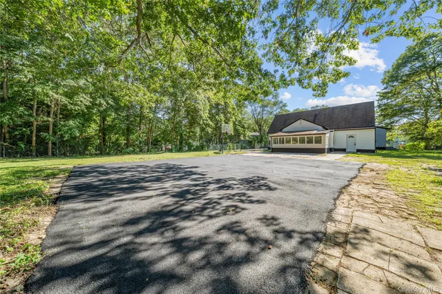 a view of a park with large trees