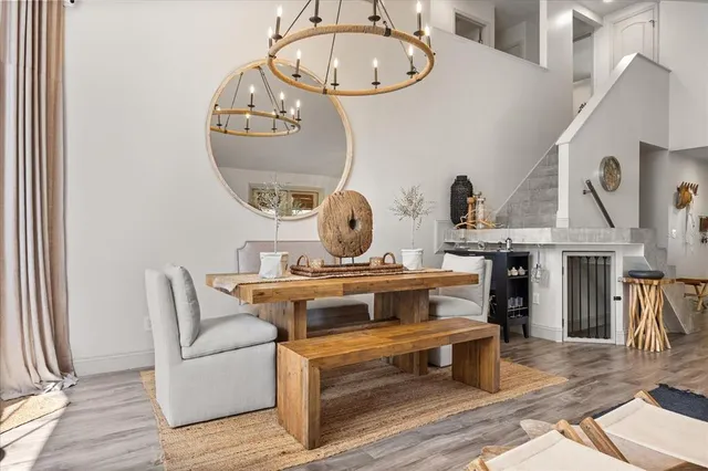 a kitchen with stainless steel appliances a stove a refrigerator and a wooden floor