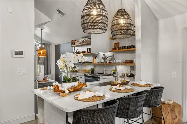 a bedroom with bed and a large window