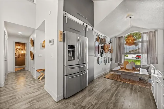 a spacious bathroom with a granite countertop toilet a sink and a mirror