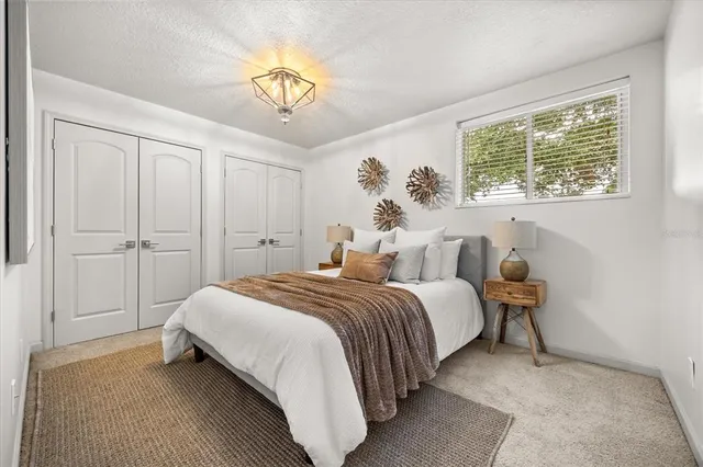 a view of a white house with a swimming pool