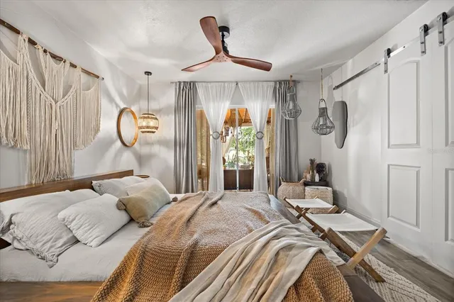 a view of a house with backyard porch and sitting area