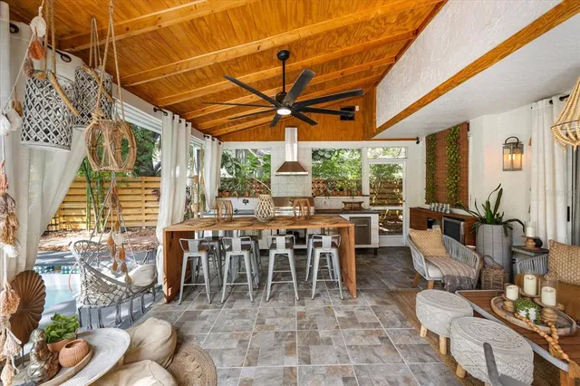 an aerial view of a house with a yard and garden