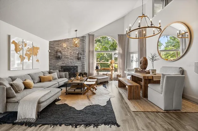 a living room with furniture and a fireplace