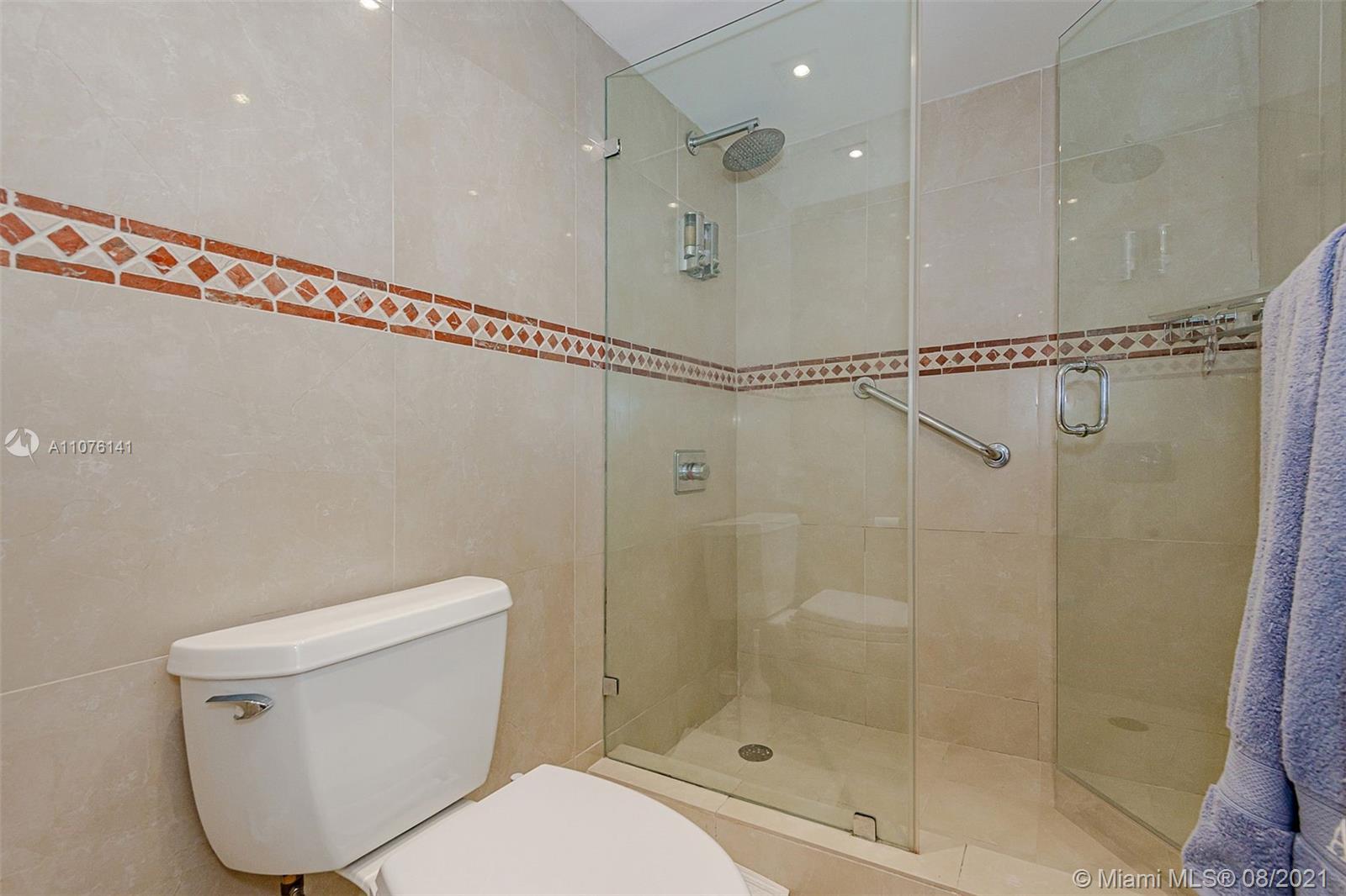 2333 Brickell Avenue, Unit 1406 Miami, FL 33129 - Photo 14 of 38 a bathroom with a shower a toilet and a shower