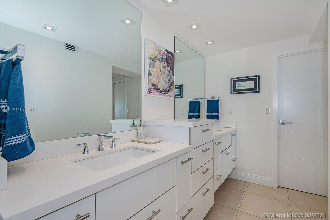 2333 Brickell Avenue, Unit 1406 Miami, FL 33129 - Photo 18 of 38 a spacious bathroom with a double vanity sink mirror and