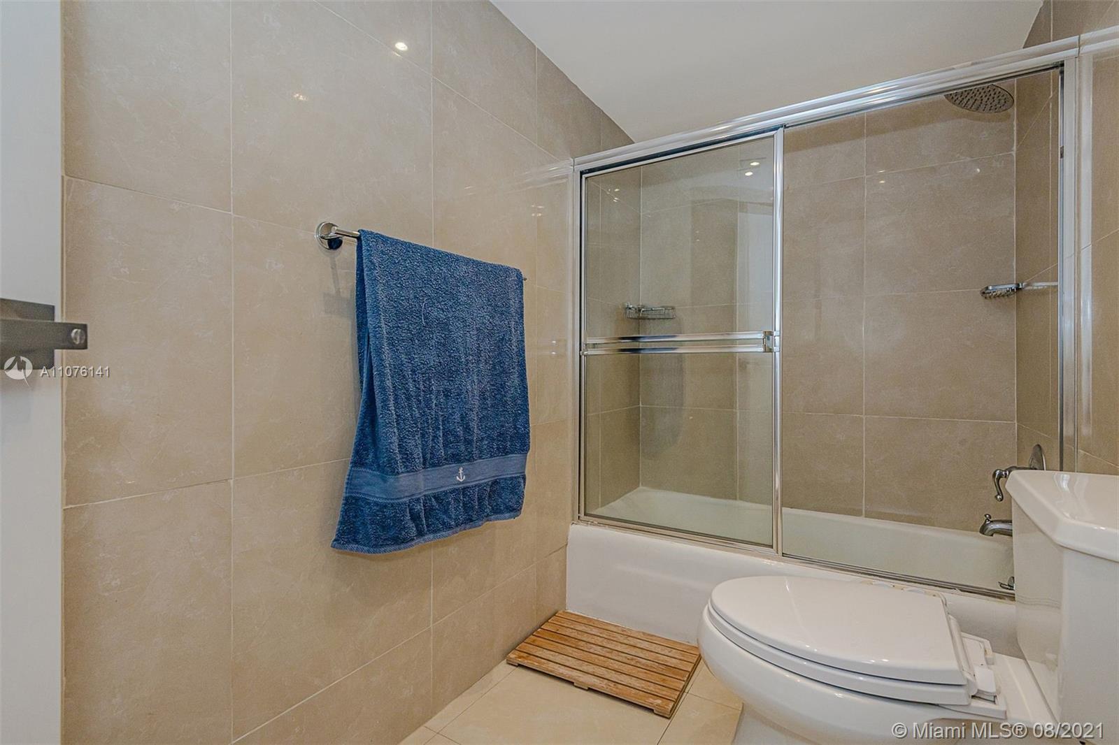 2333 Brickell Avenue, Unit 1406 Miami, FL 33129 - Photo 19 of 38 a bathroom with a shower and a toilet