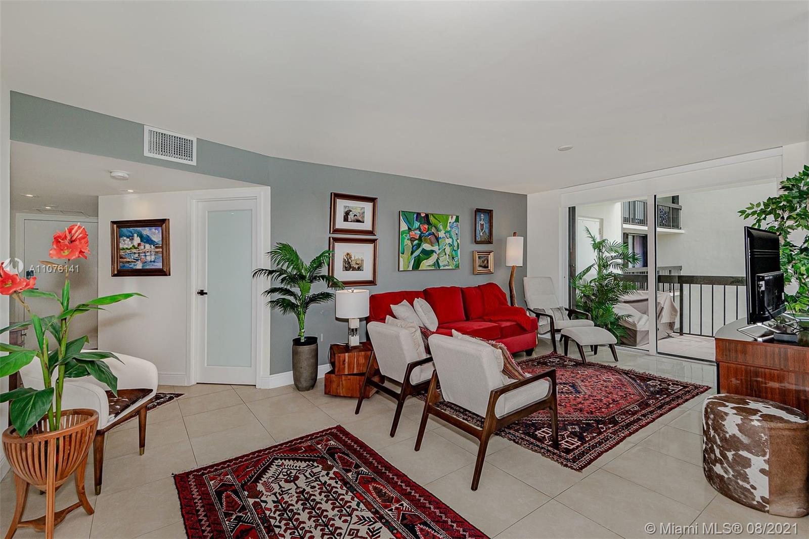 2333 Brickell Avenue, Unit 1406 Miami, FL 33129 - Photo 3 of 38 a living room with furniture rug and wooden floor