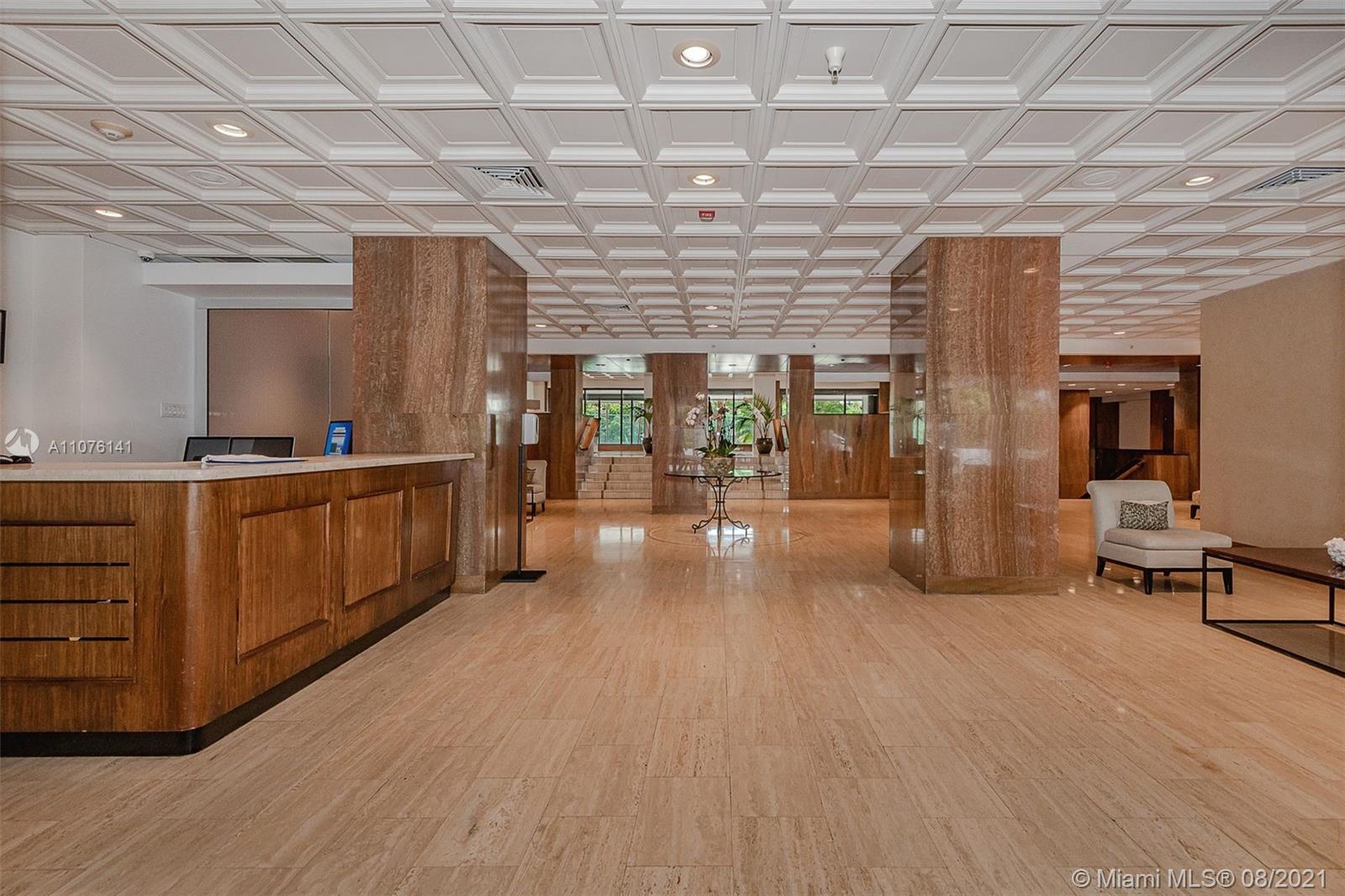 2333 Brickell Avenue, Unit 1406 Miami, FL 33129 - Photo 28 of 38 a hall with cabinets and wooden floor