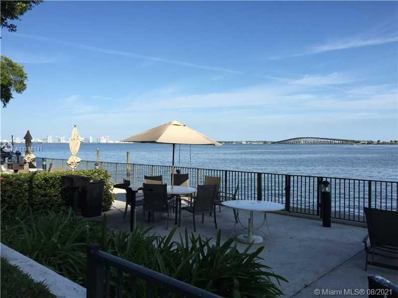 2333 Brickell Avenue, Unit 1406 Miami, FL 33129 - Photo 31 of 38 a terrace with outdoor seating and city view