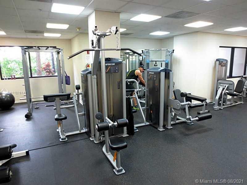 2333 Brickell Avenue, Unit 1406 Miami, FL 33129 - Photo 34 of 38 a view of a room with gym equipment