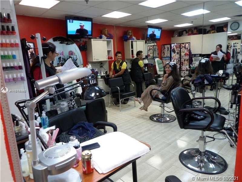 2333 Brickell Avenue, Unit 1406 Miami, FL 33129 - Photo 38 of 38 a room with gym equipment and a mirror