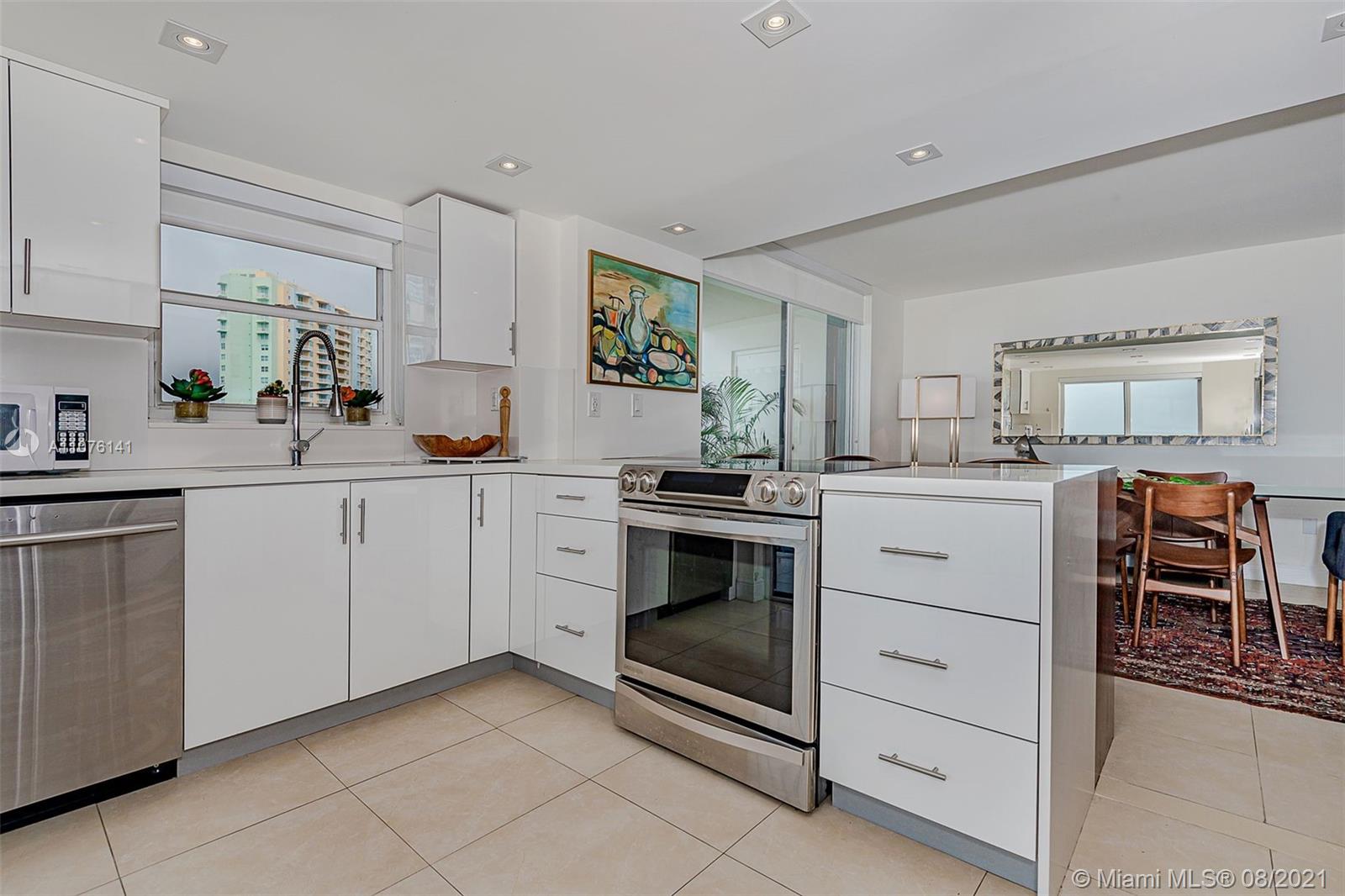 2333 Brickell Avenue, Unit 1406 Miami, FL 33129 - Photo 5 of 38 a kitchen with a stove oven and sink