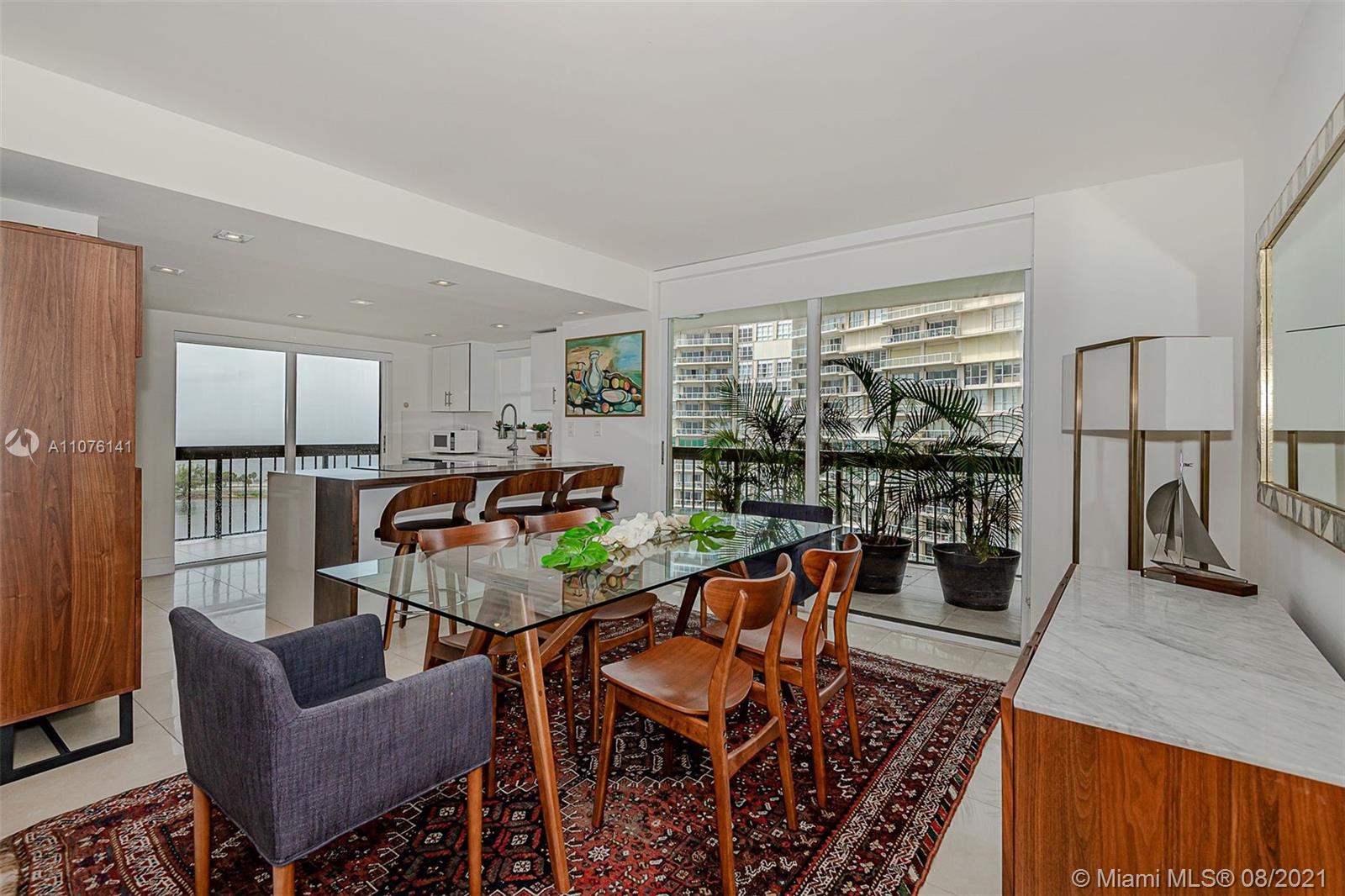 2333 Brickell Avenue, Unit 1406 Miami, FL 33129 - Photo 9 of 38 a work room with furniture and a floor to ceiling window