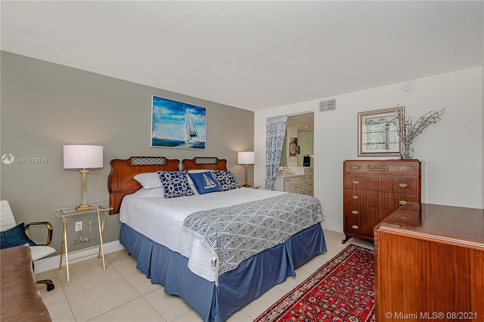 2333 Brickell Avenue, Unit 1406 Miami, FL 33129 - Photo 10 of 38 a bedroom with bed and wooden floor