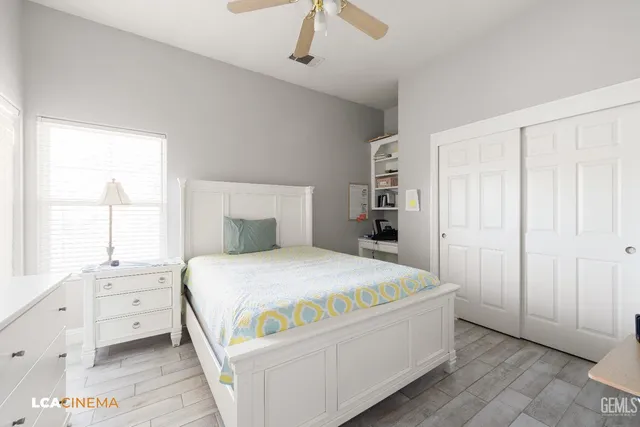 a room with a bed and a cabinets