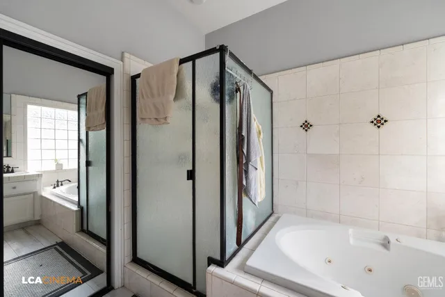 a bathroom with a bathtub and a shower