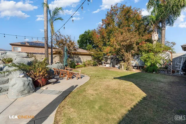 a view of a swimming pool with an outdoor seating