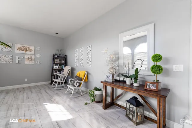 a room with furniture and a potted plant