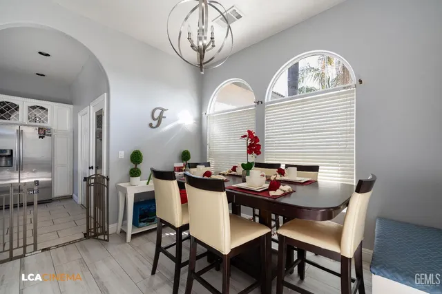 a table and chairs in a dining room with a table