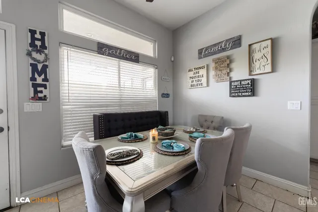 a view of a dining room that has a table and chairs