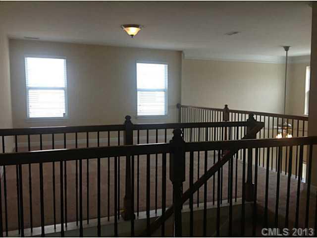 79091 Ridgehaven Road, Unit 164 Lancaster, SC 29720 - Photo 11 of 16 a view of a hallway with wooden floor