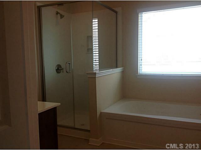 79091 Ridgehaven Road, Unit 164 Lancaster, SC 29720 - Photo 14 of 16 a bathroom with a bathtub