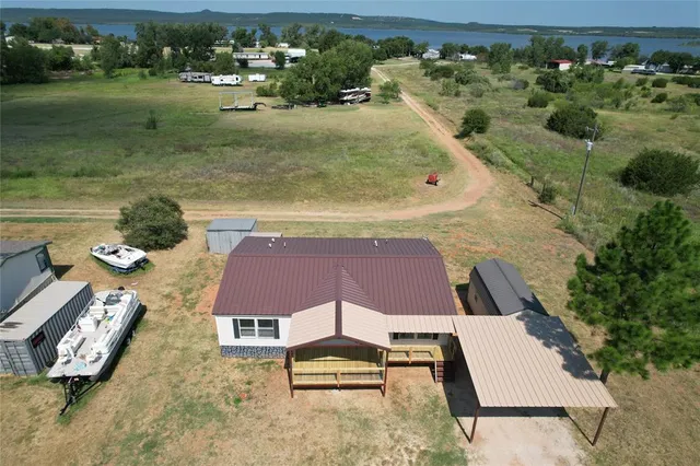 an aerial view of a house with outdoor space