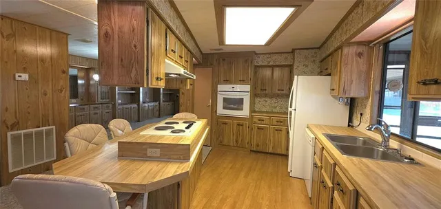 a view of a swimming pool with an outdoor space and seating area