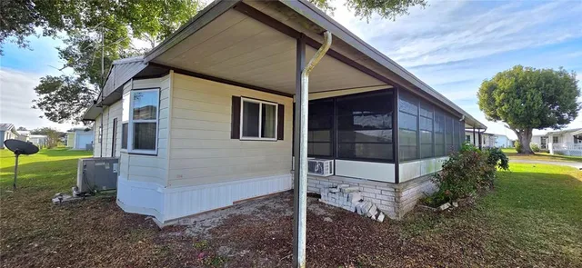 a kitchen with stainless steel appliances granite countertop a sink and a stove next to a window