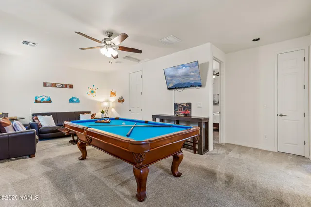 an aerial view of residential house and car parked