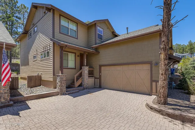a living room with furniture pool table and a window