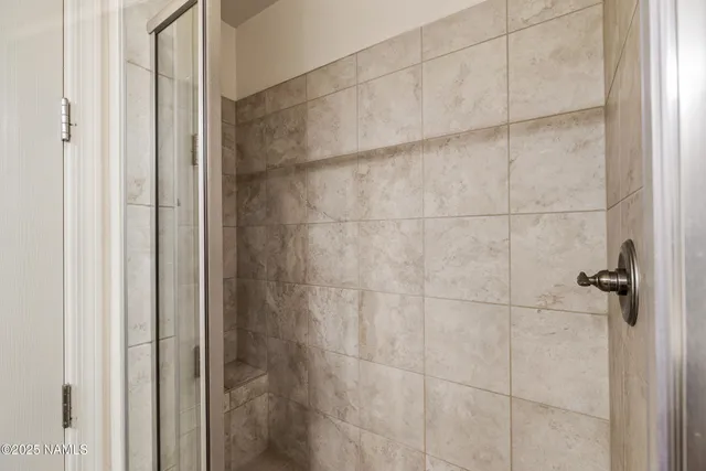 an aerial view of residential house and car parked