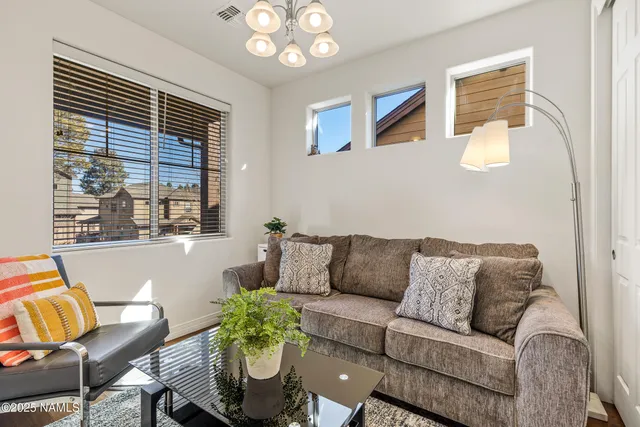 an aerial view of residential house and car parked