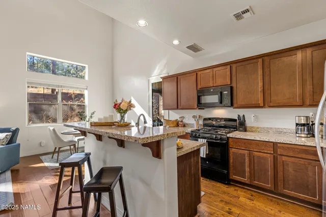 a bedroom with a bed and a mirror on dresser