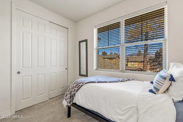 an aerial view of residential houses with outdoor space and street view