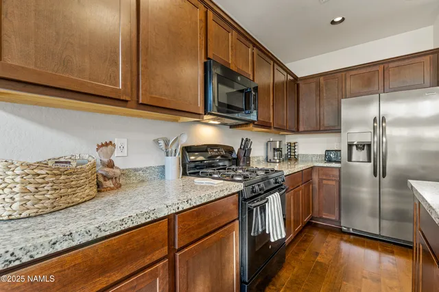 a bed room with a bed and a potted plant