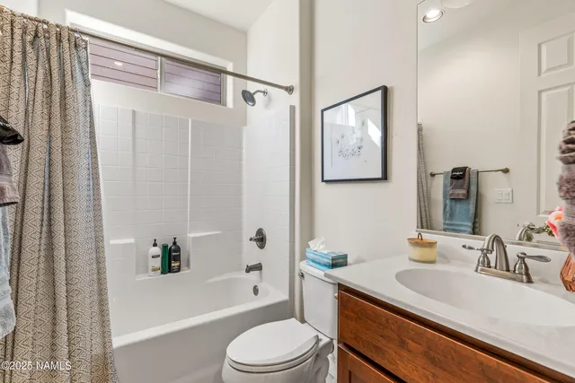 a bedroom with a bed and a desk