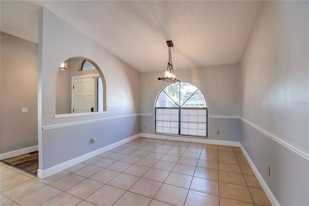 1418 Buckner Road Valrico, FL 33596 - Photo 5 of 37 a view of an empty room with a window