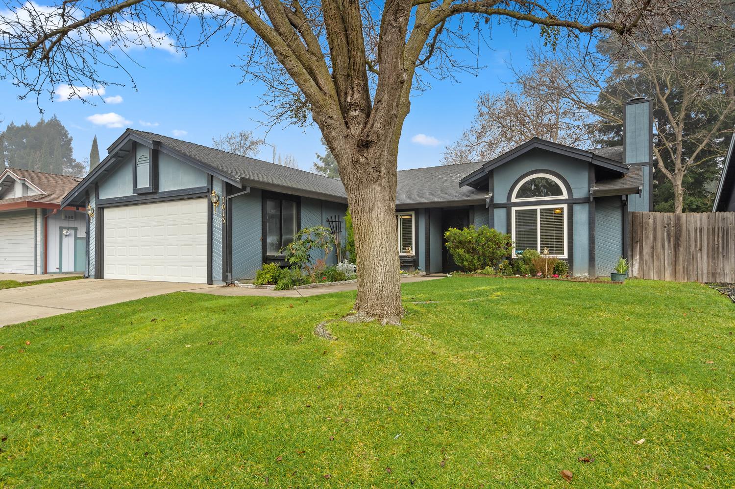 7013 Tiant Way Elk Grove, CA 95758 - Photo 1 of 17 a front view of a house with a yard