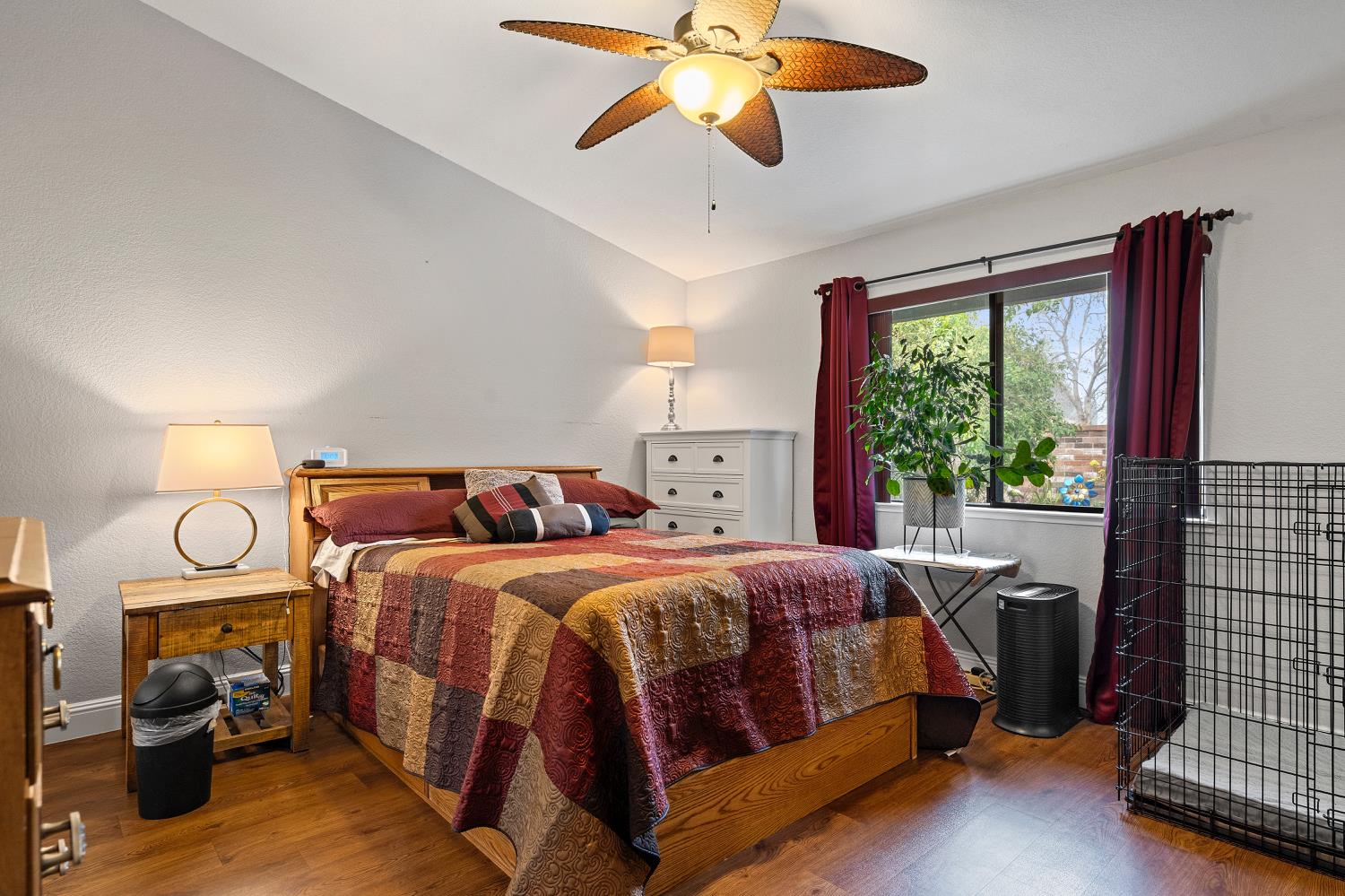 7013 Tiant Way Elk Grove, CA 95758 - Photo 8 of 17 a bedroom with a bed and wooden floor