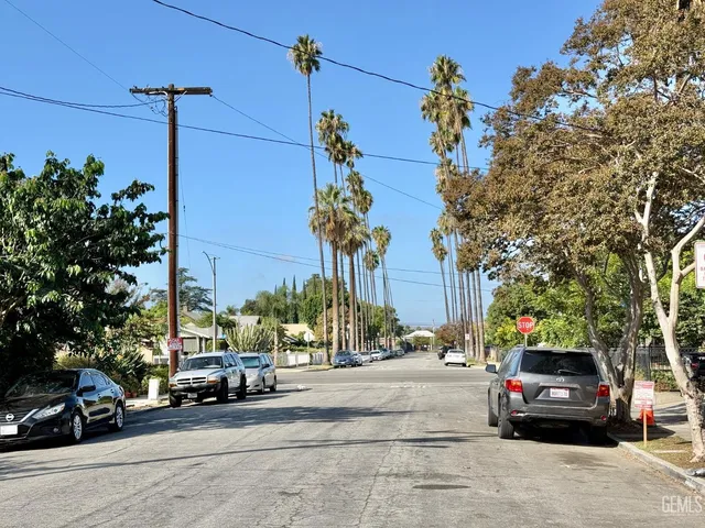 a view of street with parked cars