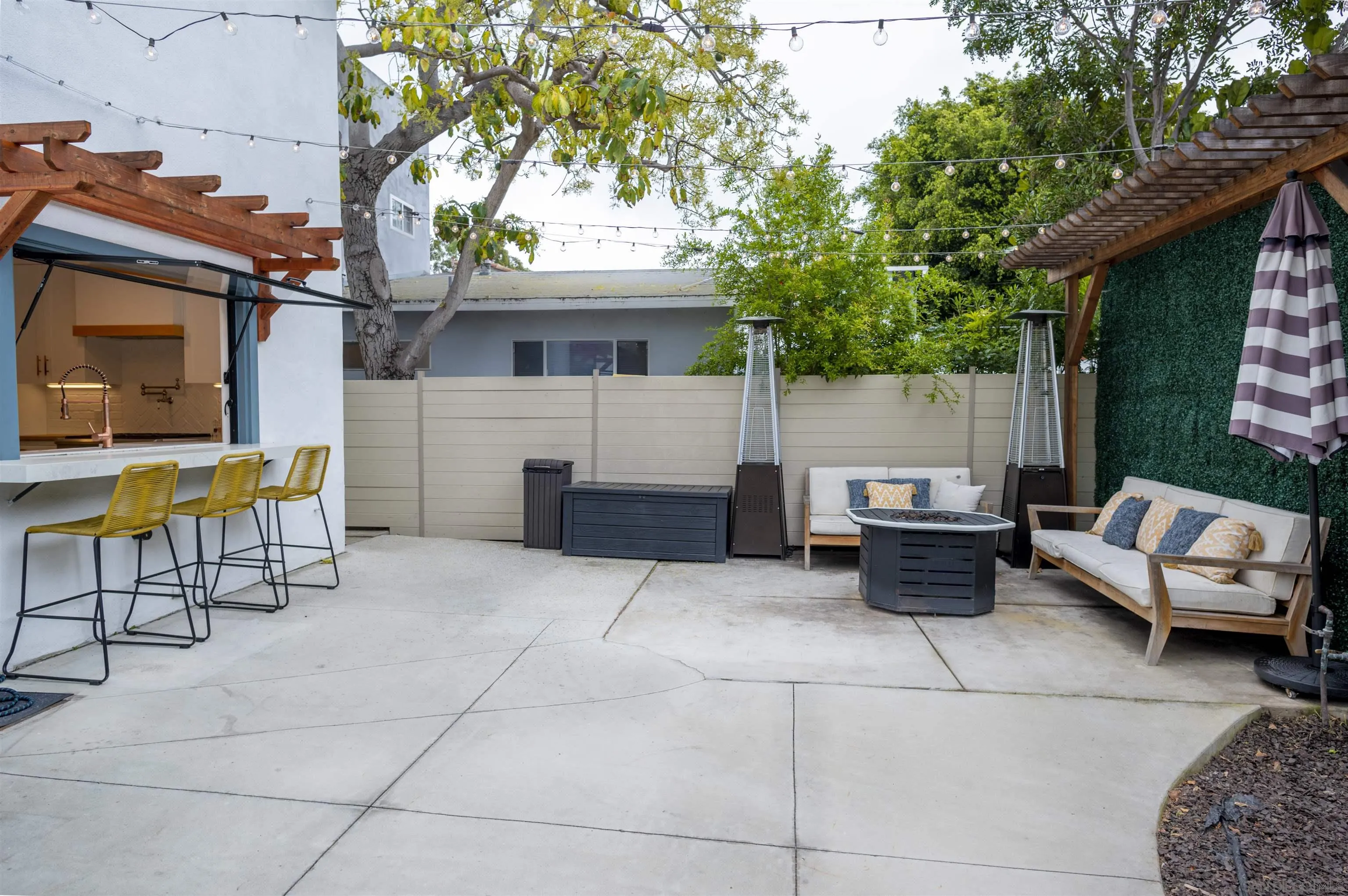 1520 Pendleton Road Coronado, CA 92118 - Photo 16 of 27 a view of a patio with a table and chairs in a patio