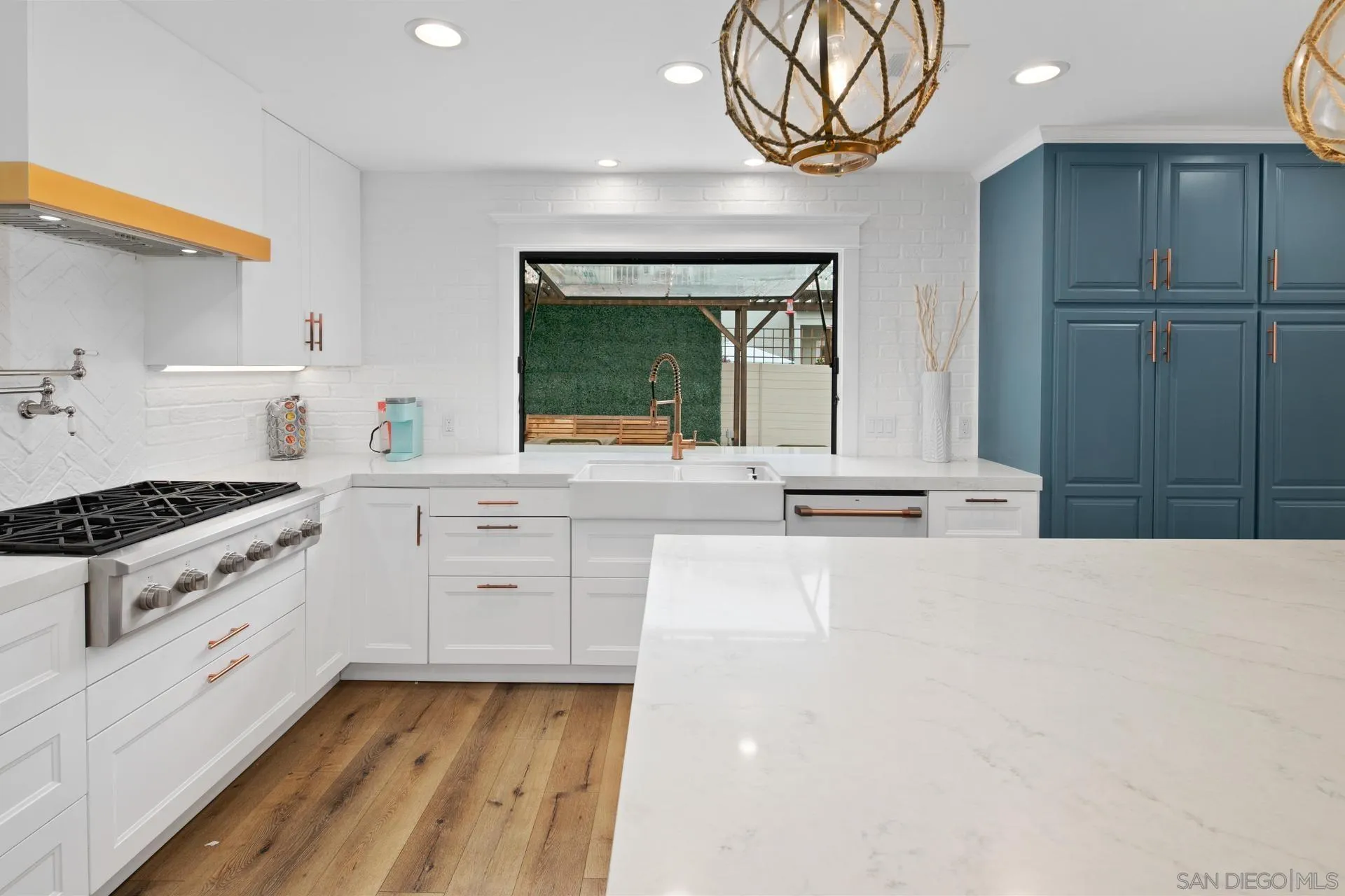 1520 Pendleton Road Coronado, CA 92118 - Photo 3 of 27 a kitchen with white cabinets and appliances