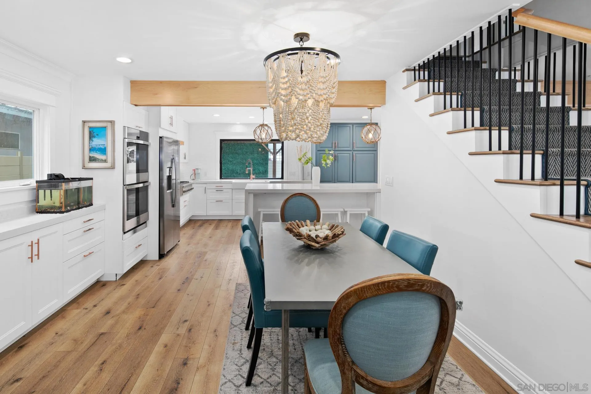 1520 Pendleton Road Coronado, CA 92118 - Photo 5 of 27 a dining room with furniture a rug and wooden floor