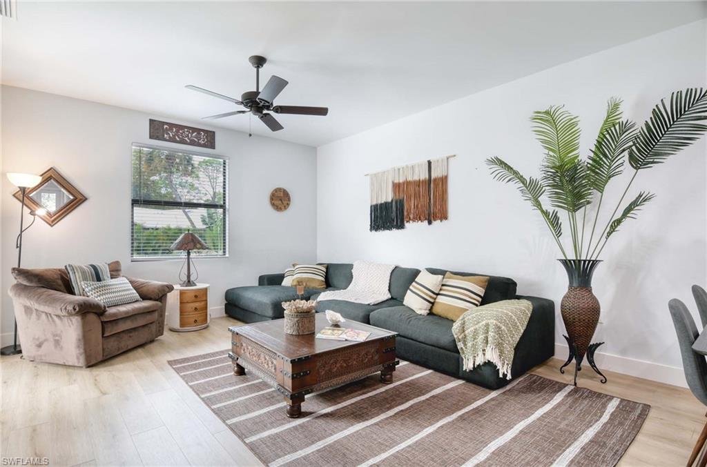 1147 Steeves Avenue Naples, FL 34104 - Photo 24 of 35 a living room with furniture and a large window