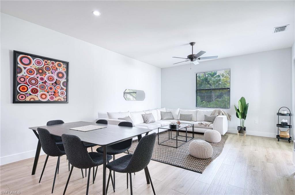 1147 Steeves Avenue Naples, FL 34104 - Photo 3 of 35 a view of a dining room with furniture window and wooden floor