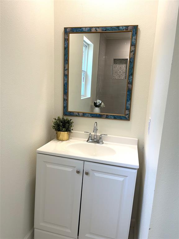 315 Hobson Street Weatherford, TX 76086 - Photo 13 of 24 a bathroom with a sink and a mirror
