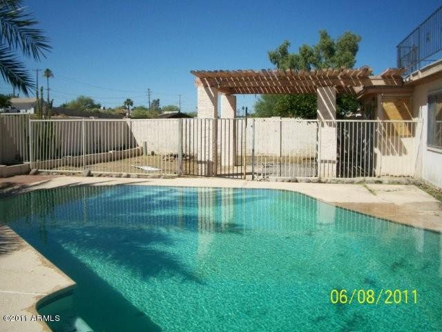 1831 West Decatur Street Mesa, AZ 85201 - Photo 2 of 10 a backyard of a house with table and chairs
