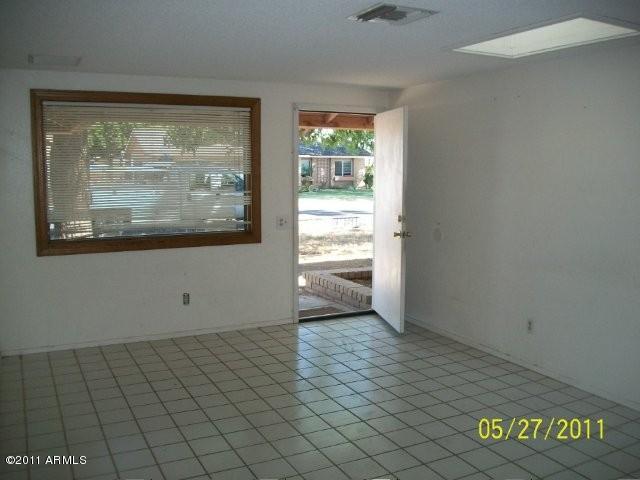 1831 West Decatur Street Mesa, AZ 85201 - Photo 6 of 10 an empty room with windows